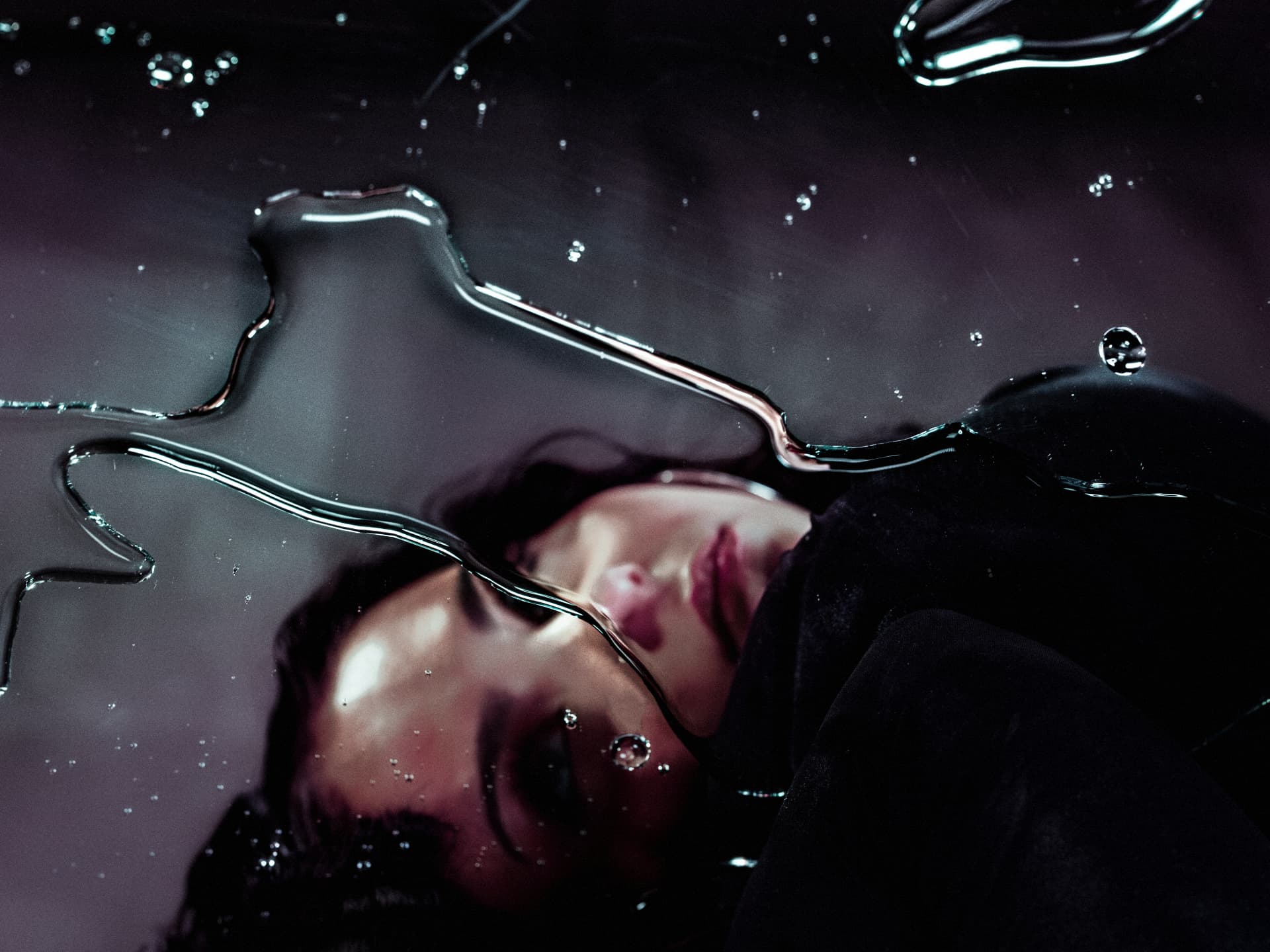 Sabyna photographed through water and glass
