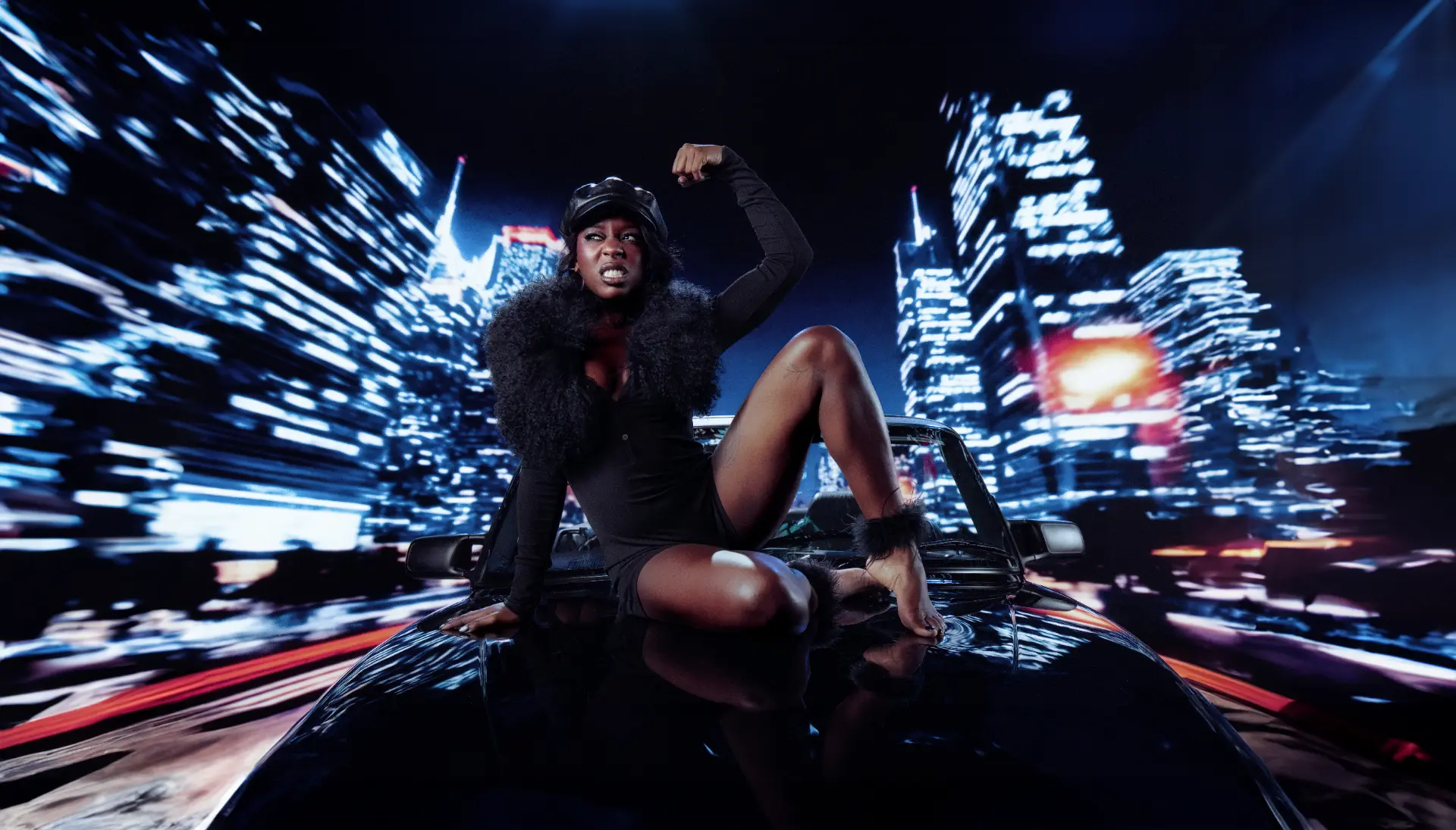 Catching Cairo — performer flexing on a car bonnet against streaked skyline lights