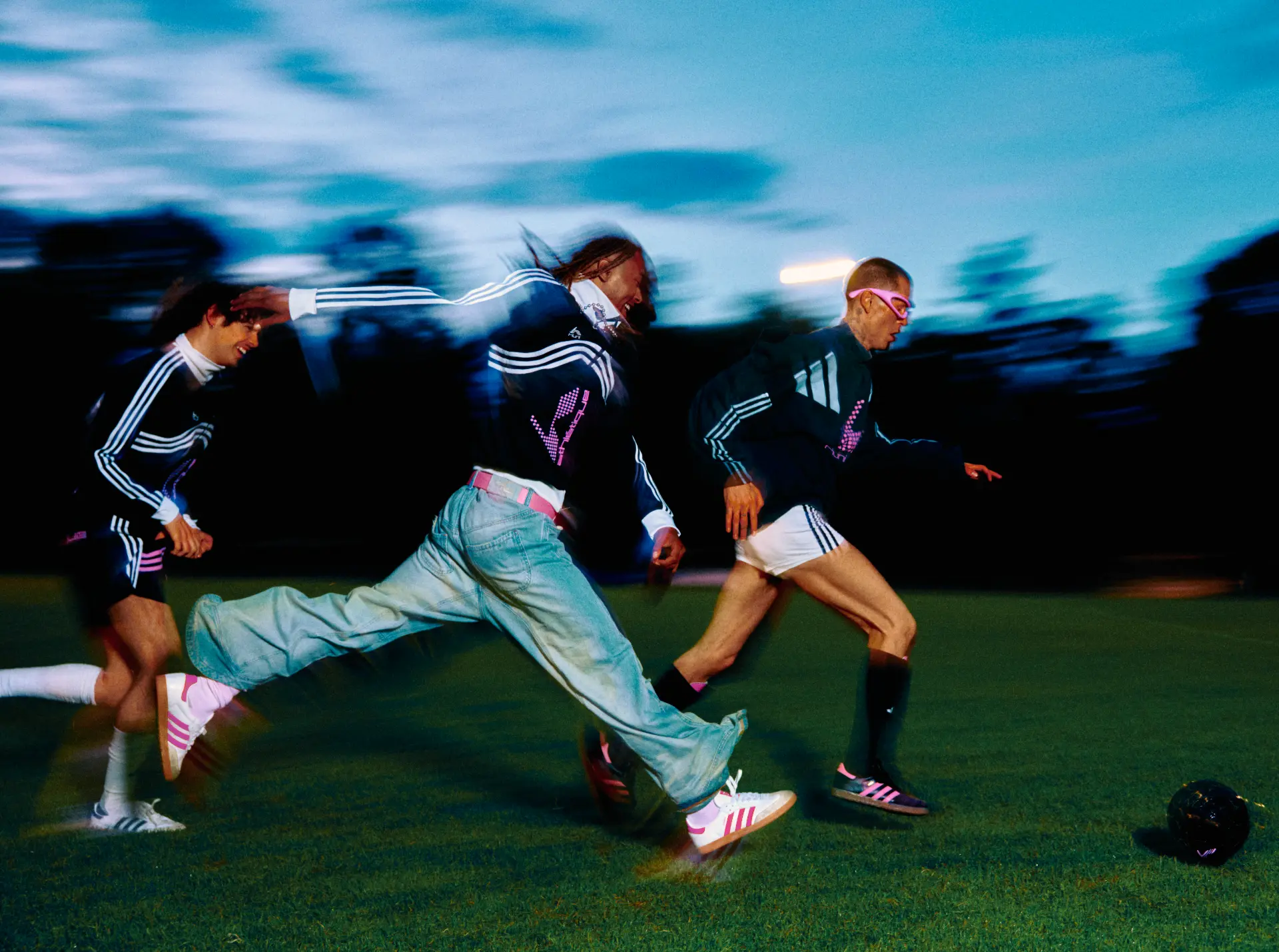 Adidas X Huni — players sprinting at dusk